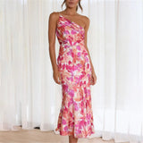 Woman wearing a pink floral one-shoulder midi dress