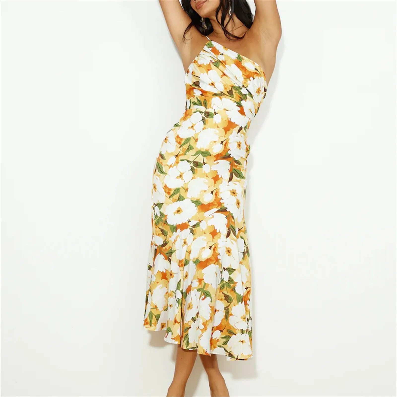 Woman wearing a yellow and white floral one-shoulder midi dress