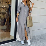 woman in a gray maxi shirt dress with a high slit