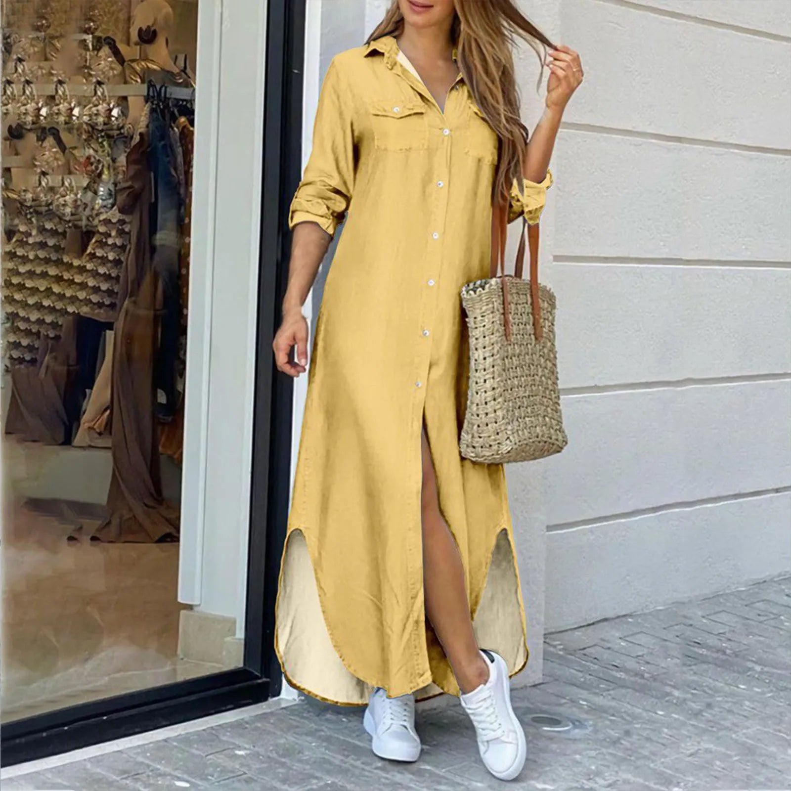 woman in a yellow maxi shirt dress with a high slit
