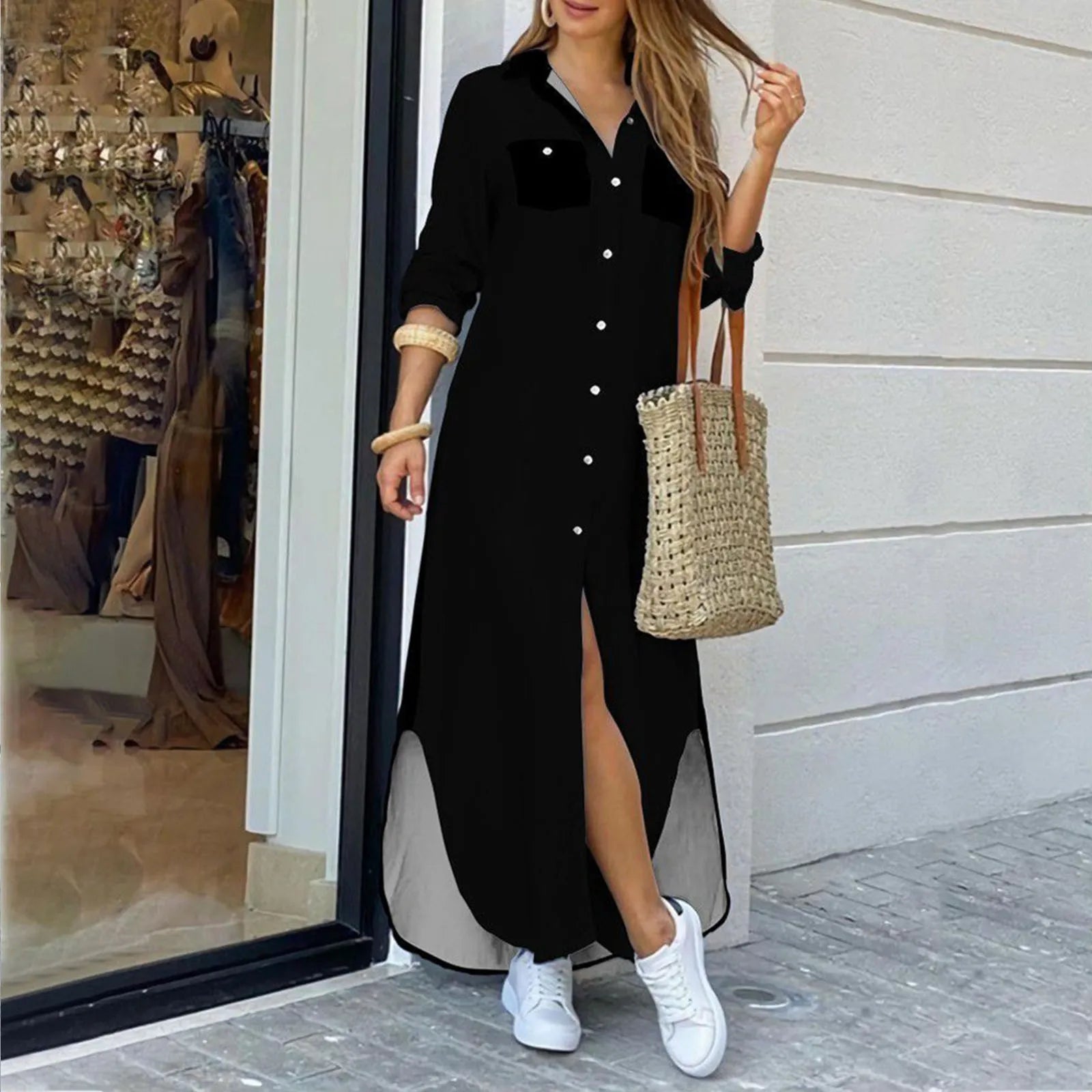 woman in a black maxi shirt dress with a high slit
