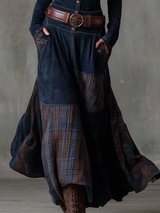 Full view of the woman in the navy blue dress, with the skirt in motion.