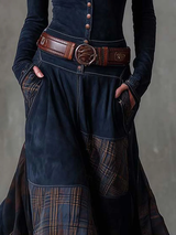 Detail of the plaid patchwork and pockets on the navy blue dress.