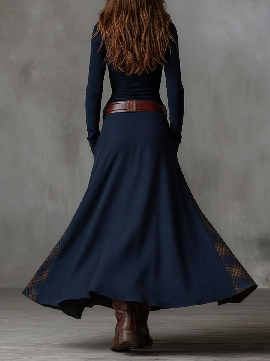 Back view of the navy blue dress showing the flowing skirt.