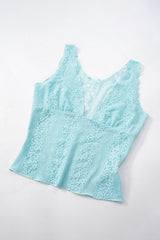 A light blue lace tank top laid flat on a white background