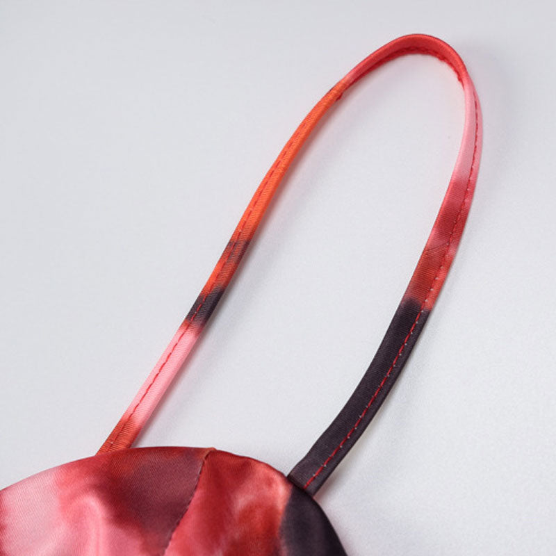 Close-up of the strap of a tie-dye top