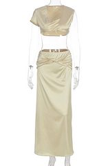 Mannequin displaying a beige satin crop top and maxi skirt set.