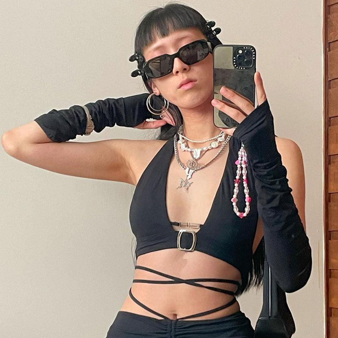 woman in black halter top and skirt with strappy details
