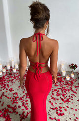 Back view of a woman in a red crochet knit maxi dress