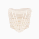 A white strapless corset top with sheer overlay and boning details, displayed on a white background.