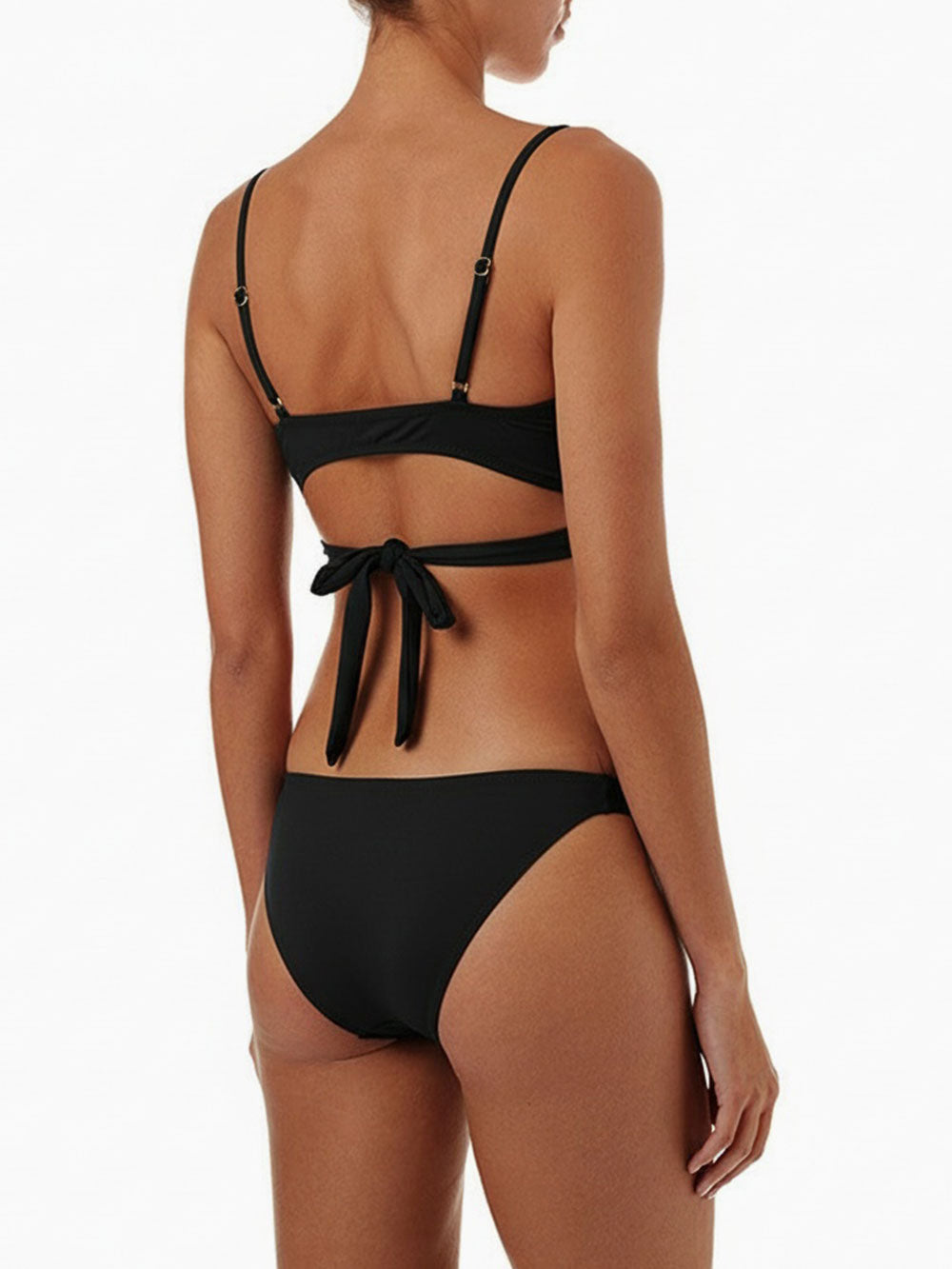 back view of a woman wearing a black bikini