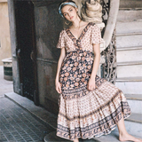 woman wearing a floral print maxi dress outdoors