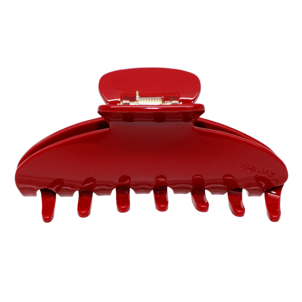 A red claw clip on a white background.