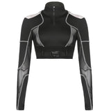 Front view of a black long-sleeved crop top with mesh panels, cut-out shoulders, zip-up front, and buckle detail.