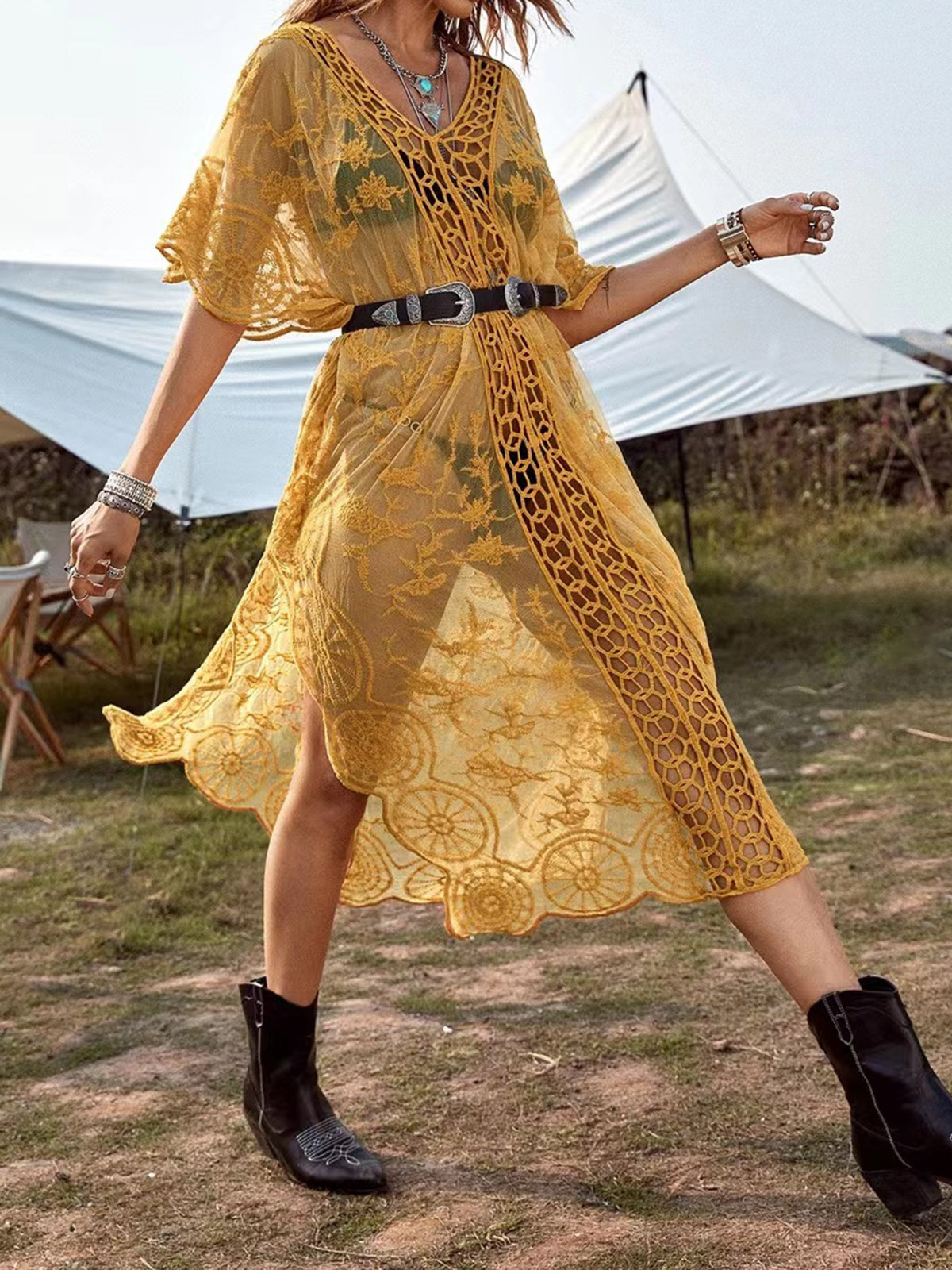Woman in a yellow lace dress with a belt