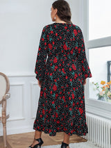 Back view of a plus-size woman in a black floral and polka dot midi dress.
