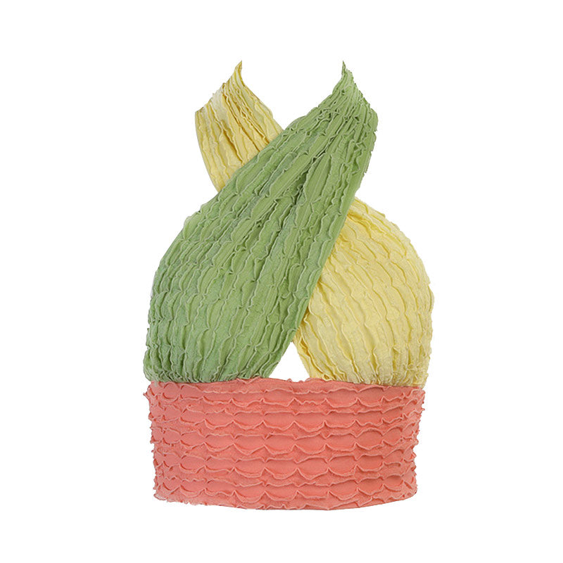 A studio shot of a colorful halter top with green, yellow, and pink sections.