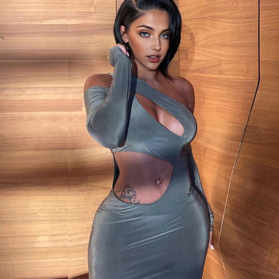 Woman wearing a gray one-shoulder maxi dress with cut-outs