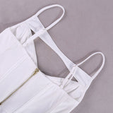 Close-up of the back straps and zipper on a white corset top.