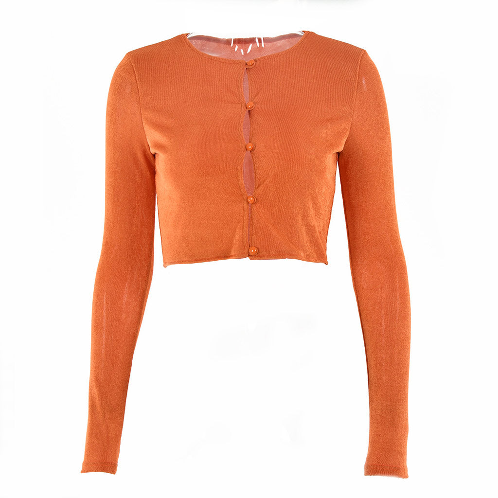 Orange cropped cardigan with long sleeves and a button-up front, laid flat.