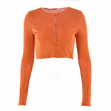 Orange cropped cardigan with long sleeves and a button-up front, laid flat.