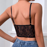 back view of a black lace corset top with adjustable straps