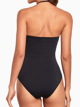 back view of woman in black strapless one-piece swimsuit