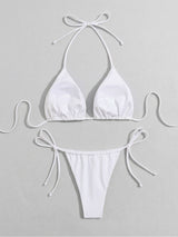 White bikini top and bottom laid flat with label detail