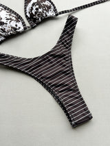 Close-up of brown and white striped bikini bottoms
