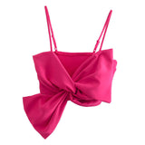 Hot pink bow crop top on a white background
