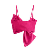 Back of a hot pink bow crop top on a white background