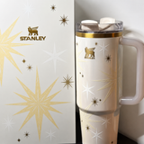 Stanley Celestial Star 40oz insulated tumbler in soft cream with gold starburst pattern and hanging star charm - View 7 | Clistos