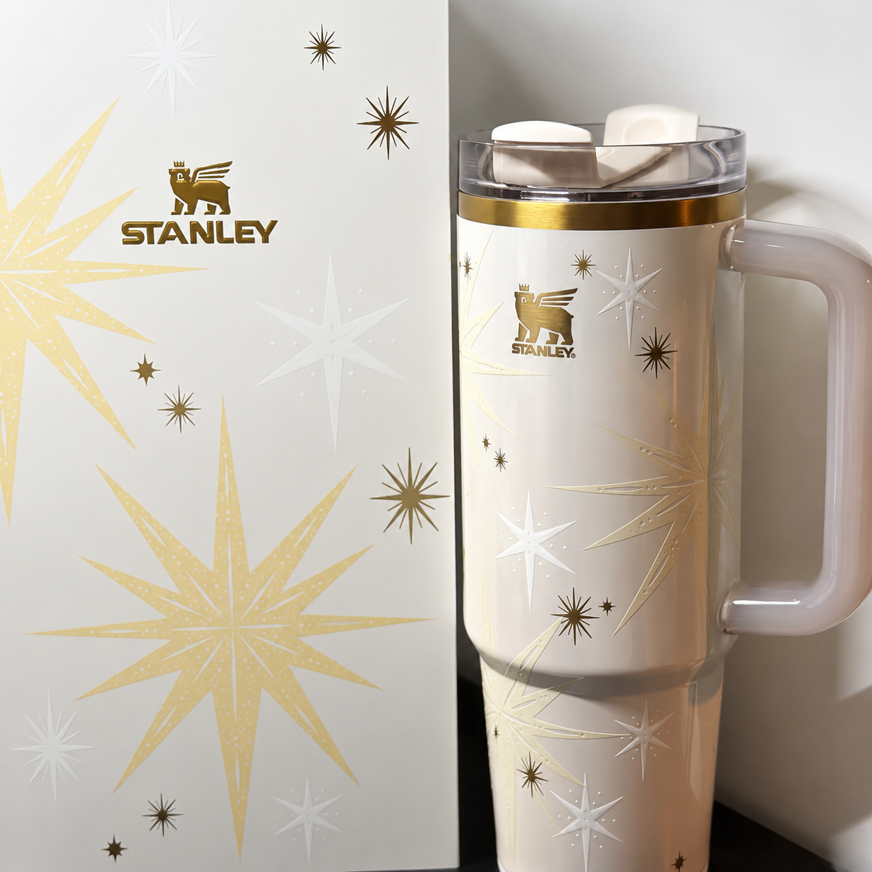 Stanley Celestial Star 40oz insulated tumbler in soft cream with gold starburst pattern and hanging star charm - View 7 | Clistos