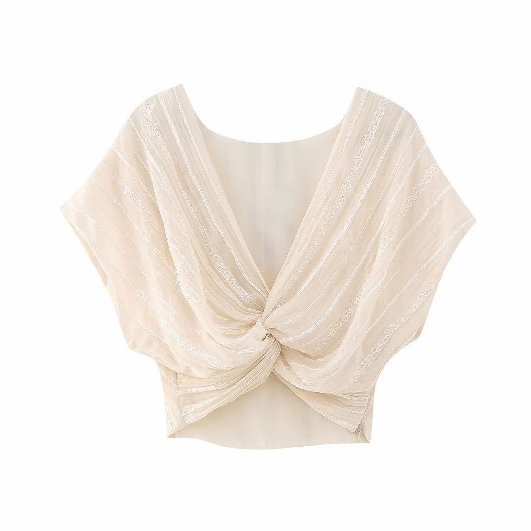 front view of a cream twisted crop top