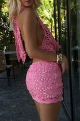 Side view of a woman's body in a pink crochet knit set.