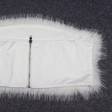 Close-up of the back of a white garment with a zipper closure and a fluffy white fur trim.