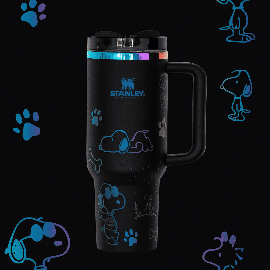 Stanley Snoopy 40 oz insulated tumbler in white with blue Peanuts illustrations, ergonomic handle, and straw - View 2 | Clistos