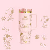 Stanley Snoopy 40 oz insulated tumbler in white with blue Peanuts illustrations, ergonomic handle, and straw - View 3 | Clistos