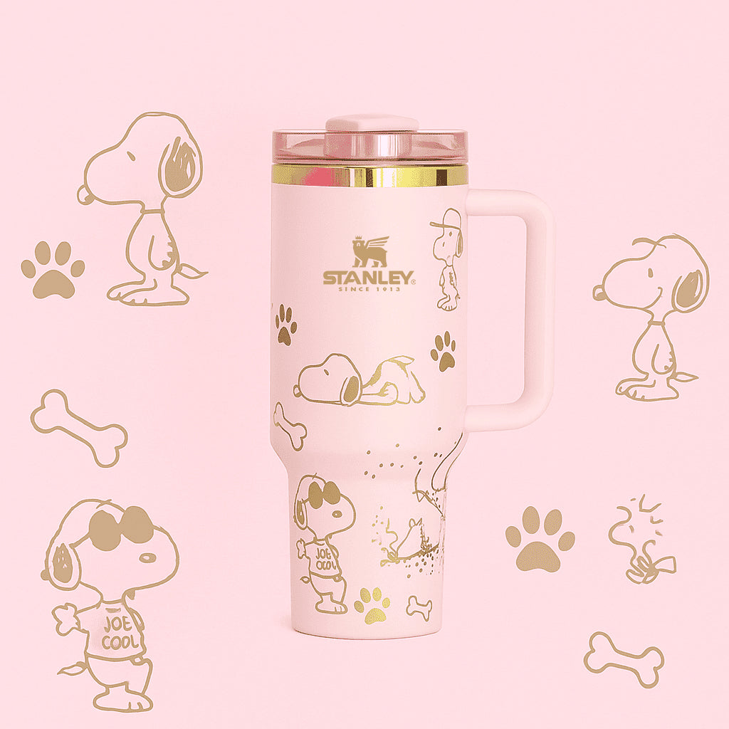 Stanley Snoopy 40 oz insulated tumbler in white with blue Peanuts illustrations, ergonomic handle, and straw - View 3 | Clistos