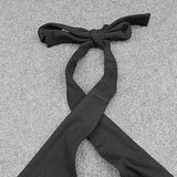 close up of a black halter top tie back