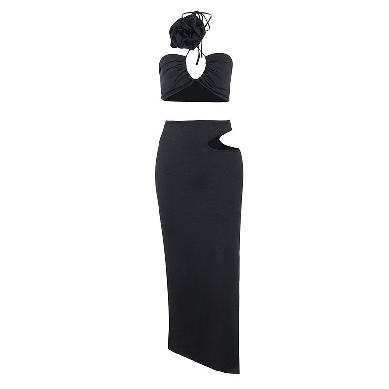 black halter neck crop top and matching maxi skirt with cut-out details