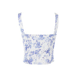 Back view of a white and blue floral print corset top