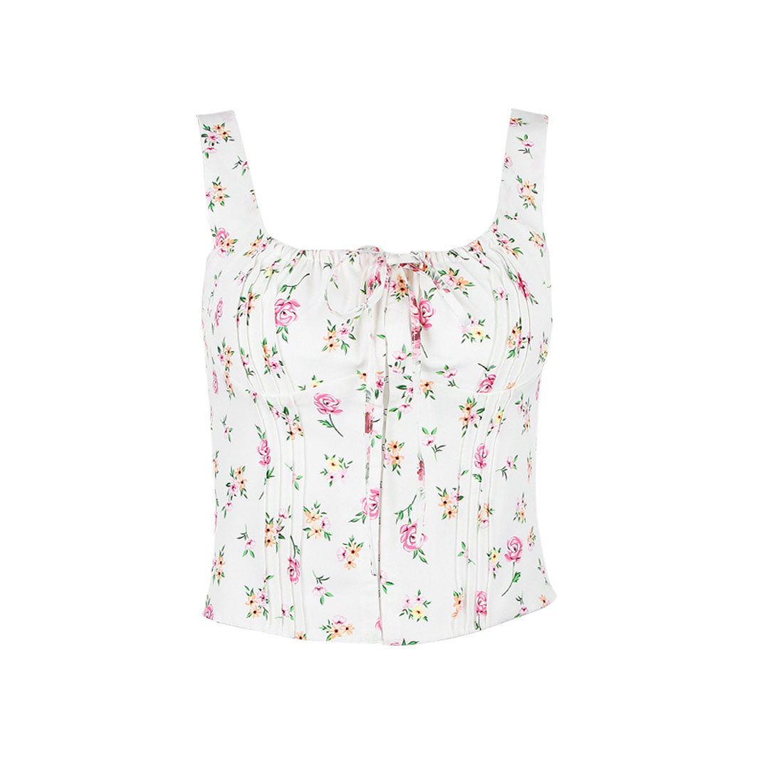 Front view of a white floral print corset top with spaghetti straps and a tie front.
