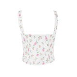Back view of a white floral print corset top with spaghetti straps.