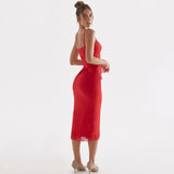 A woman in a red satin midi dress with lace trim and corset detailing is shown from the back against a white background.