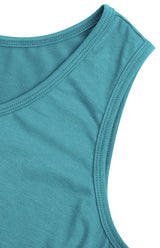 Close-up of the teal scoop neckline and sleeveless armhole of a dress.
