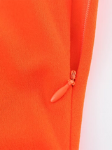 Close-up of orange dress zipper