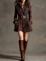 Model wearing a plaid shirt dress with a brown belt and boots