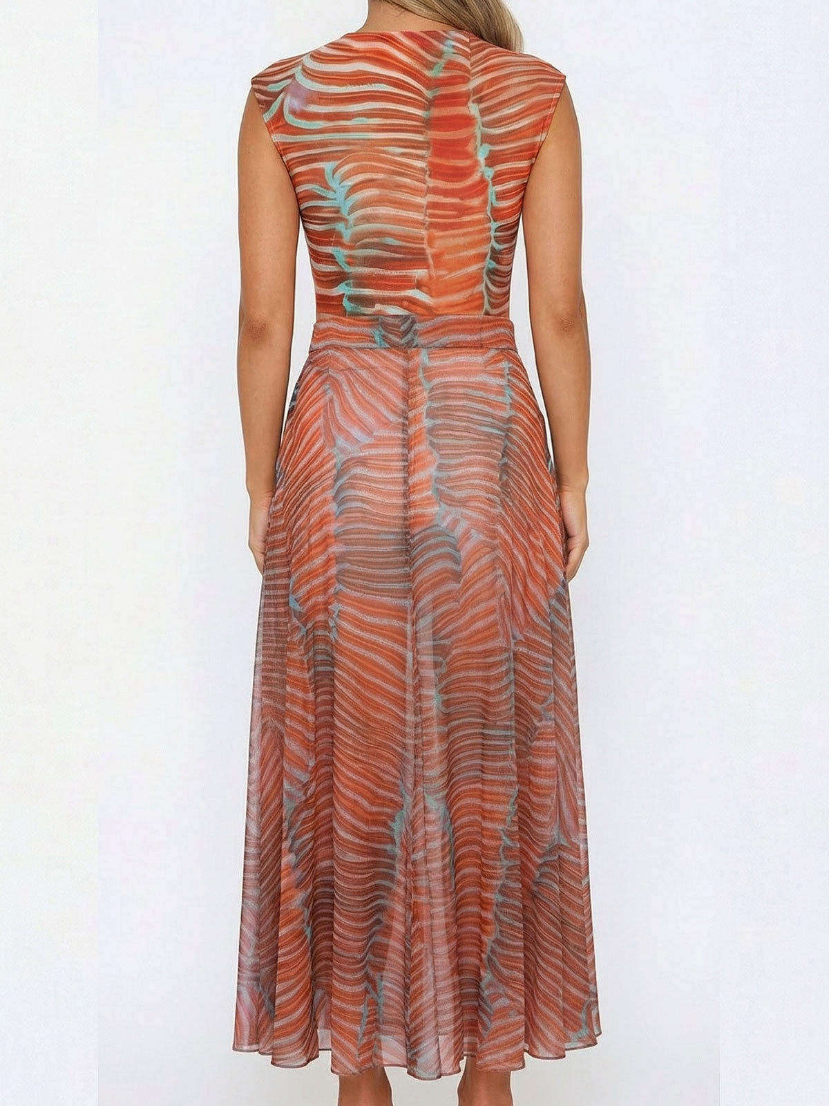 Rear view of a woman wearing an orange and blue patterned sheer maxi dress with a round neckline and sleeveless design.