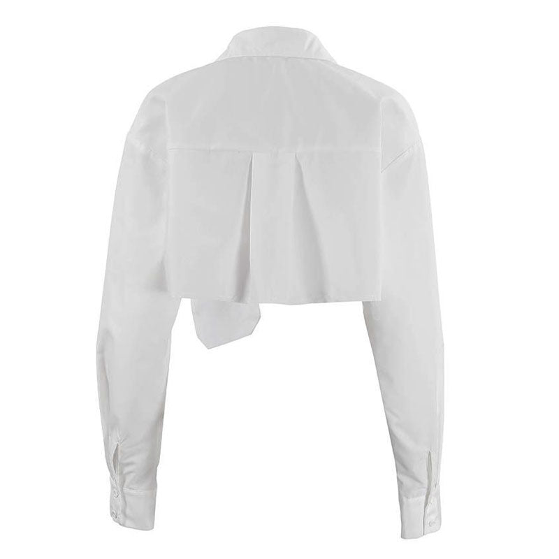 Back view of a white cropped button-up shirt with a collar and pleated back detail